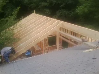 Framing a new roof addition that ties into an existing shingle roof in Queensbury