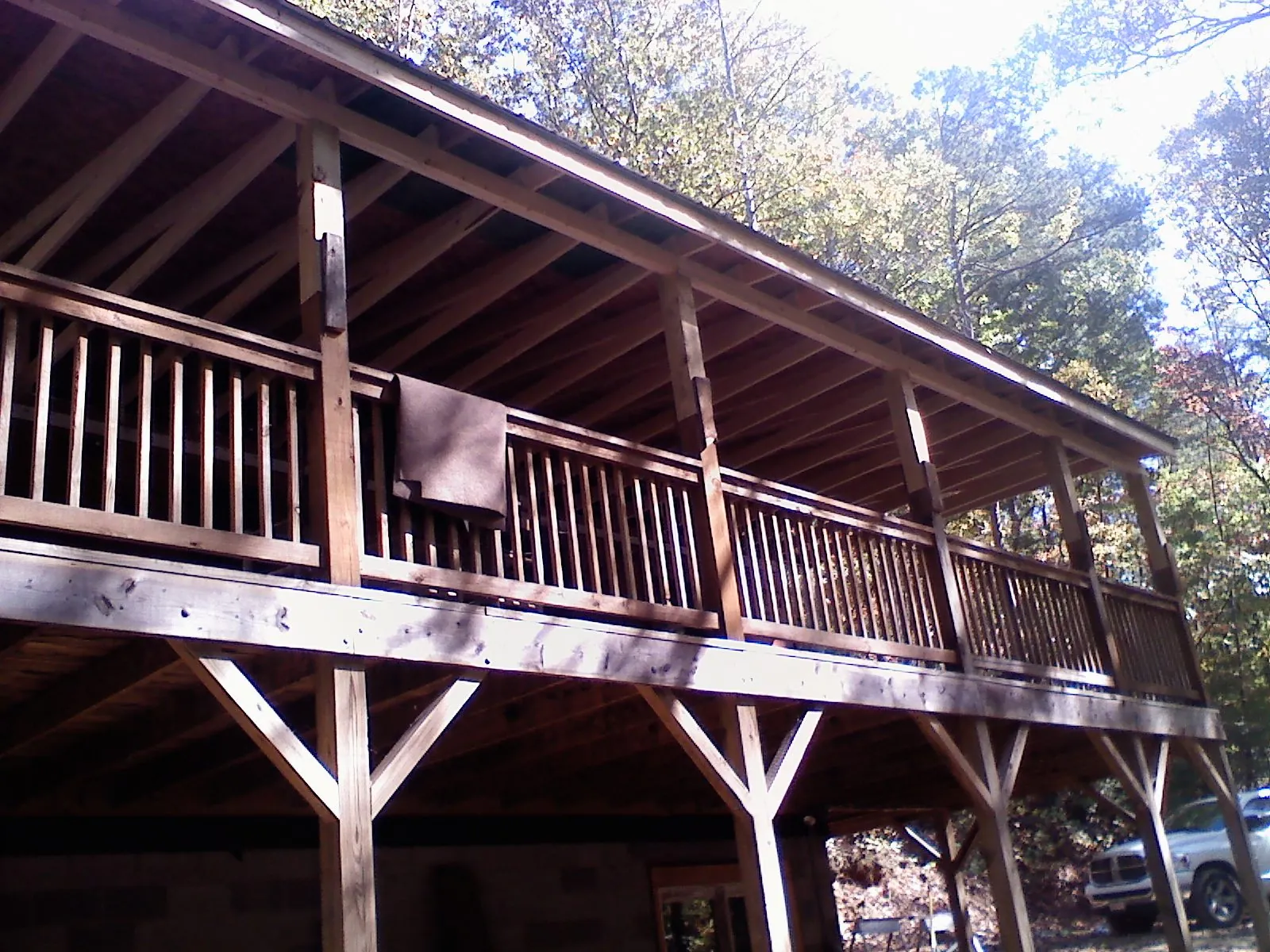 Timber framing under a new elevated porch and deck — Roof Leak Repair in Queensbury by Roofing Brothers